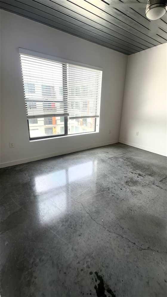 Clean bedroom with polished floors after cleaning, Houston apartment